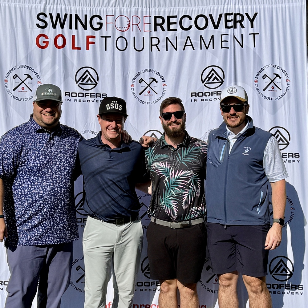 Team poses at the Swing Fore Recovery golf outing.