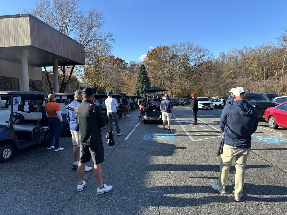 People gather for the Swing Fore Recovery golf tournament.